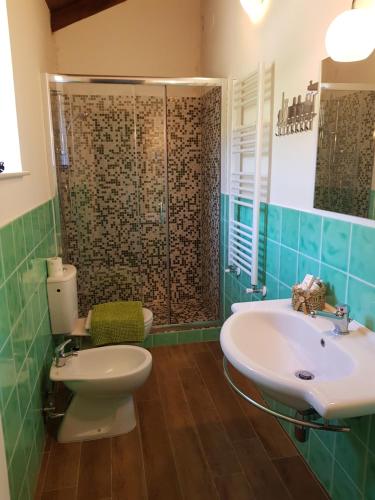 a bathroom with a sink and a toilet and a shower at Tenuta Di Maro in Sticciano