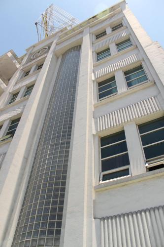 a tall building with a lot of windows at Hotel Plaza del Arco Express in Monterrey