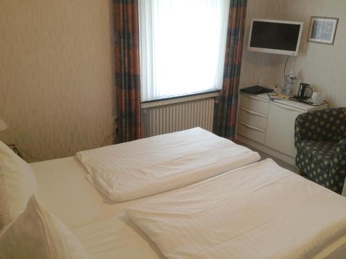 Кровать или кровати в номере Haus am Meer Steinhude