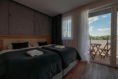 Postel nebo postele na pokoji v ubytování Apartmány pri vstupe do Aquaparku