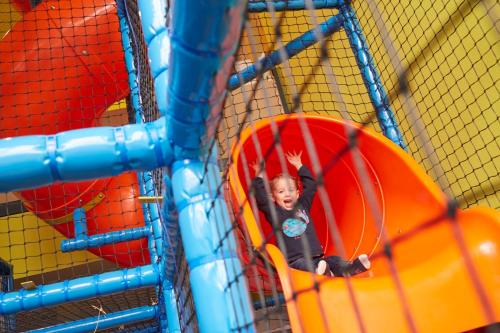 a young child playing on a inflatable at Youth Hostel Beaufort in Beaufort