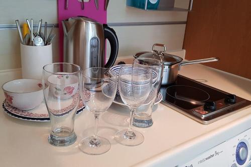 a group of wine glasses sitting on a kitchen counter at Samseong Coexmall AA in Seoul