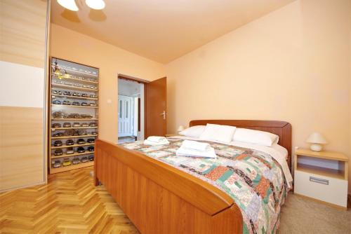 Posteľ alebo postele v izbe v ubytovaní Apartman Olive Garden
