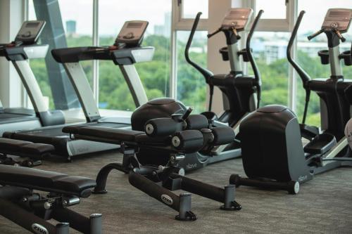 a row of exercise bikes in a gym at Residence26 in Yangon