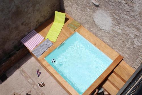 an overhead view of a swimming pool on a wooden floor at CAL GENERAL in La Cellera de Ter