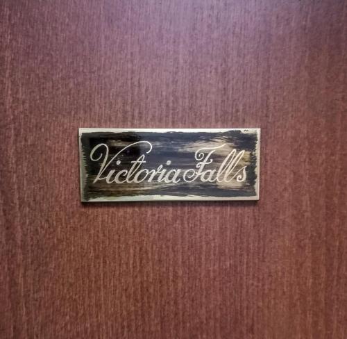a sign on a door with the name of a hotel at Villa Watamu in Trzęsacz