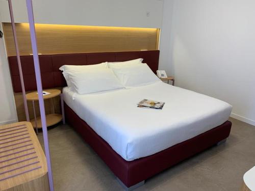 Letto o letti in una camera di M&F Hotel