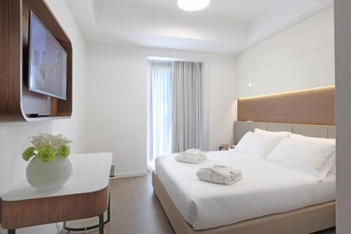 Letto o letti in una camera di M&F Hotel