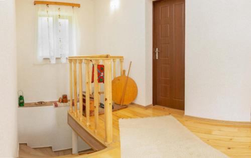 a room with a wooden staircase with a door at Villa Samodiva in Yagodina