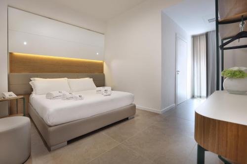 Letto o letti in una camera di M&F Hotel