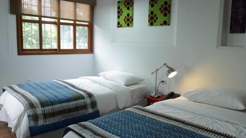 Postel nebo postele na pokoji v ubytování Iguanazu Bed & Breakfast