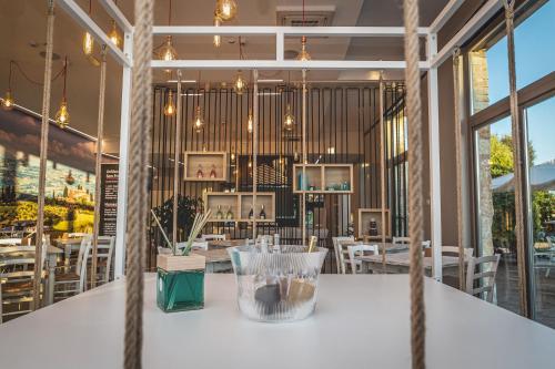 a white table in a restaurant with tables and chairs at Antico Podere San Francesco in Vada