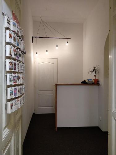 a conference room with a table and a door at HoBar Hostel in Budapest