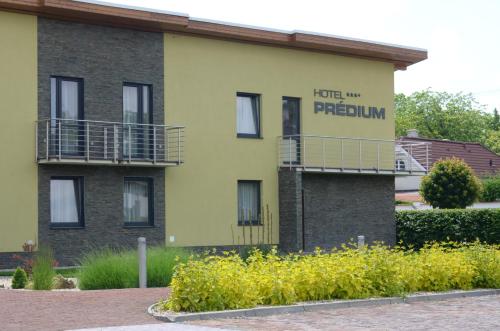 a building with a sign that reads hotel ni peremium at Hotel Predium in Vráble