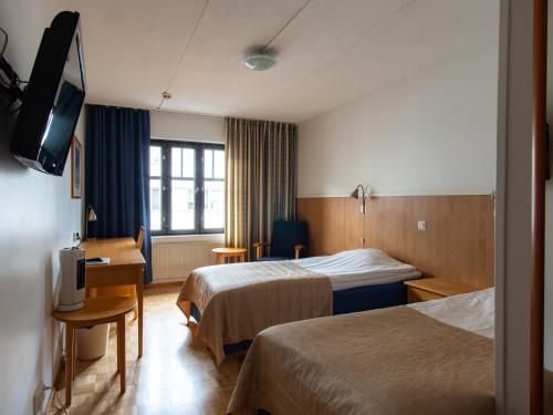 מיטה או מיטות בחדר ב-Hotel Jahtihovi