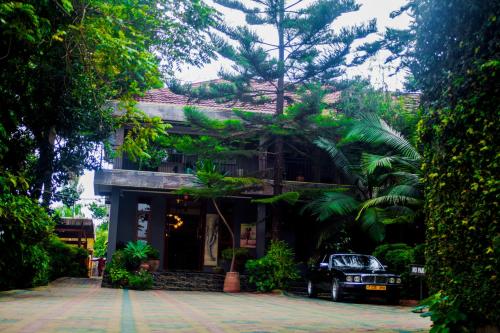a building with a car parked in front of it at Tulia Boutique Hotel & Spa in Arusha