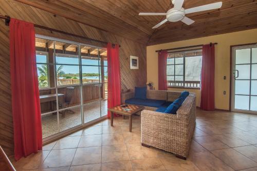 a living room with a couch and a table at Wikkid Resort in Dixon Cove