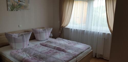 מיטה או מיטות בחדר ב-Haus Anna