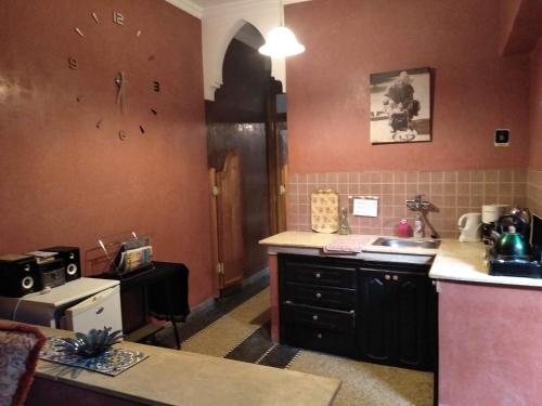 a kitchen with a sink and a counter top at Dar Rmila 4 in Marrakesh