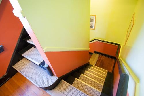 an empty flight of stairs in an elevator at Ocean Island Inn | Backpackers | Suites in Victoria