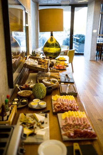 a buffet line with many different types of food at Casa de Uco Vineyards and Wine Resort in Los Árboles