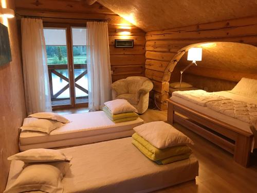 Een bed of bedden in een kamer bij Bērzi