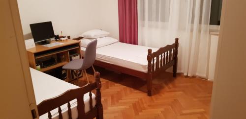 Postel nebo postele na pokoji v ubytování Apartman "Lara"