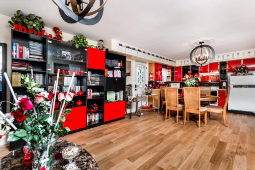 a living room with red cabinets and a dining room at Diana's Luxury Bed and Breakfast in Vancouver