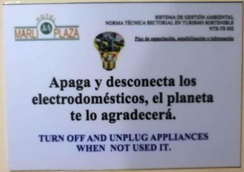 a sign with a light bulb on top of a wall at Hotel Marli Plaza in Mocoa