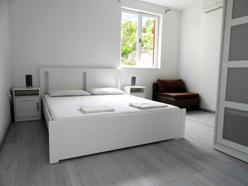 Ένα ή περισσότερα κρεβάτια σε δωμάτιο στο Hrstich Apartments