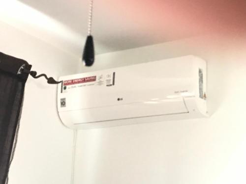 a white air conditioner hanging from a ceiling at El Bosque, tu entrada a la Sierra Gaditana. in El Bosque