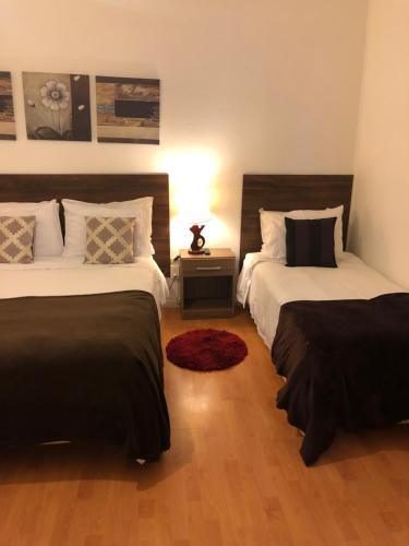 Katil atau katil-katil dalam bilik di Matic Apartments