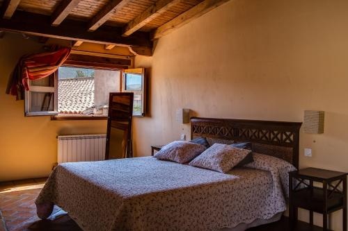 מיטה או מיטות בחדר ב-La Posada Del Corralón