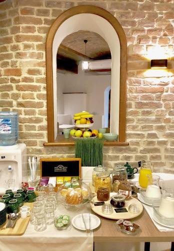 a table with food on it in a kitchen at M House Belgrade Residence in Belgrade