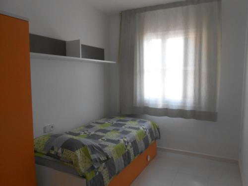 Een bed of bedden in een kamer bij El racó de Pals