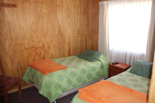 Cama o camas de una habitación en Hostal Internacional
