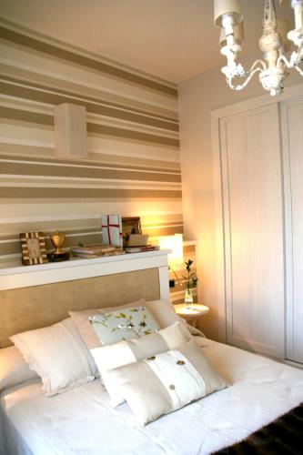 a bedroom with a bed with pillows on it at Hotel Castillo de Alquézar in Alquézar