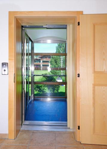 an open door with a view of a balcony at Chalet Z`Wichjehüs in Zermatt