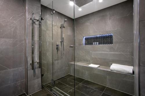 a bathroom with a shower and a glass shower stall at Best Western Sanctuary Inn in Tamworth