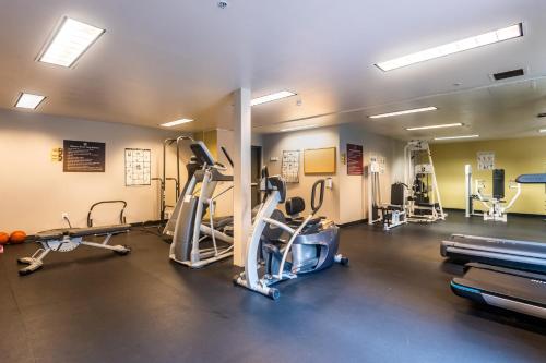 a gym with treadmills and cardio equipment in a room at Cozy home nearby most attractions Seattle center in Seattle