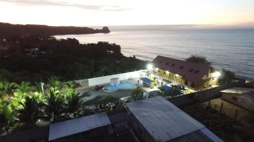 an aerial view of a resort and the ocean at Hotel Soberao in Esmeraldas