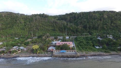 an aerial view of a house on an island in the water at Hotel Soberao in Esmeraldas