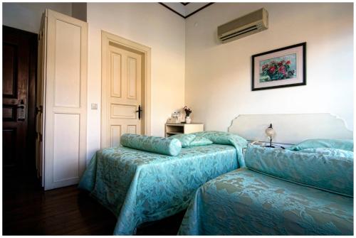 a bedroom with a bed and a couch in it at Minyon Hotel in Antalya