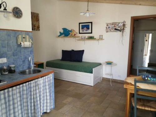 a room with a bed in the corner of a room at Villa Rossana in Scopello