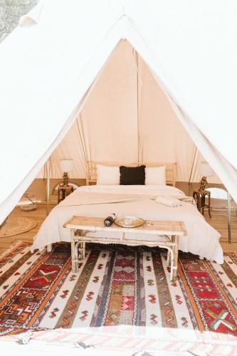 a bedroom with a bed in a tent at Dreamsea Mediterranean Camp in Benitachell
