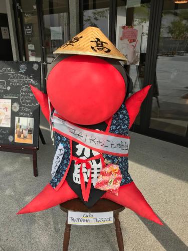 a stuffed animal wearing a hat sitting on a stool at BEYOND HOTEL Takayama 2nd in Takayama