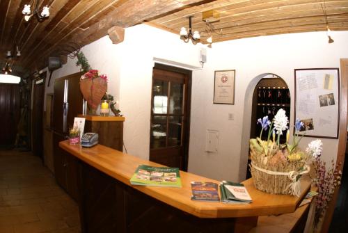 a tasting room with a wooden counter in a wine cellar at Landhotel Grätz in Emmering