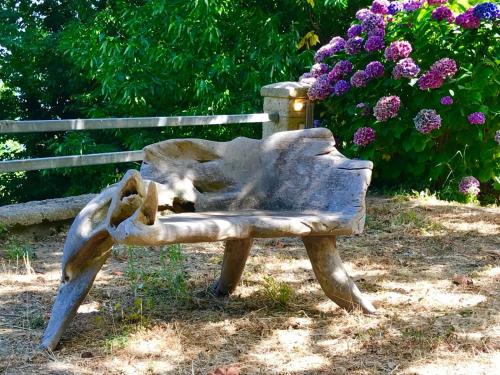 a statue of a cat sleeping on a bench at Chateau Cascara in Mouresi