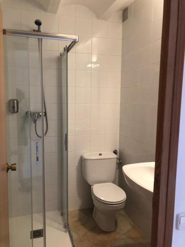 a bathroom with a toilet and a sink at CASA RUGALL in Monrós