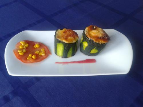a plate of food with vegetables and a tomato at Mendi Alai in Carranza